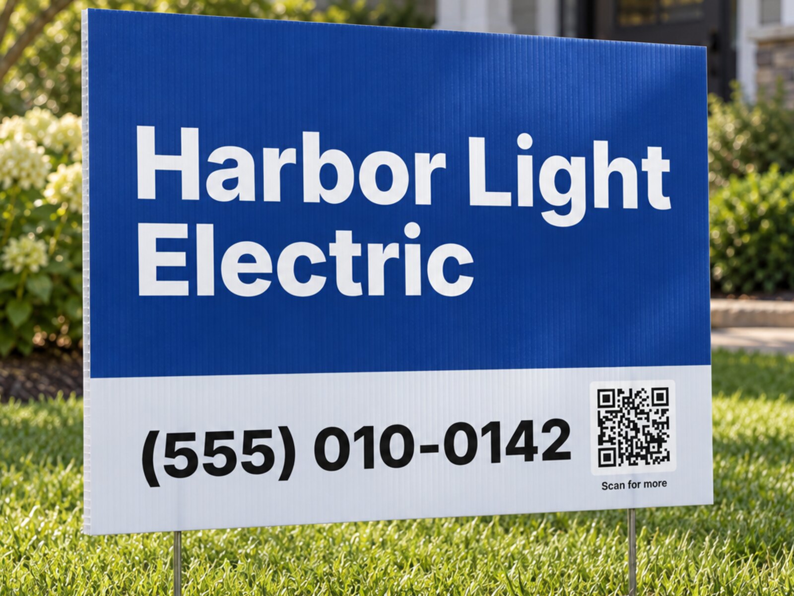 Example Harbor Light Electric yard sign on a lawn, with a large phone number and a scan code